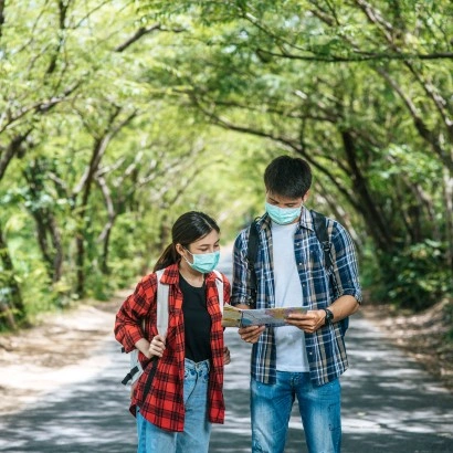 male-female-tourists-wear-medical-masks-look-map-street (1) (1)